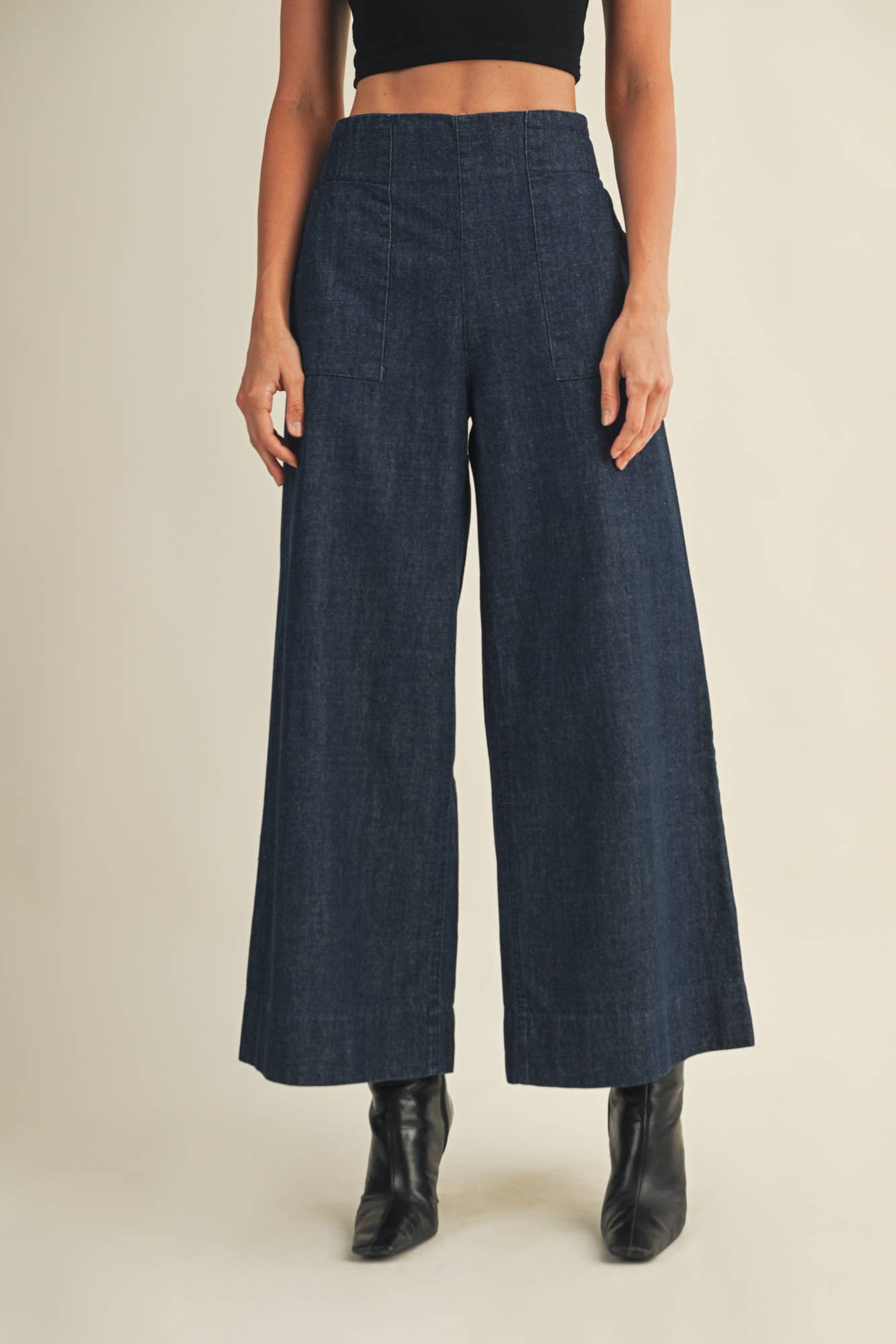 Wide-leg indigo denim pants with elastic back waistband.