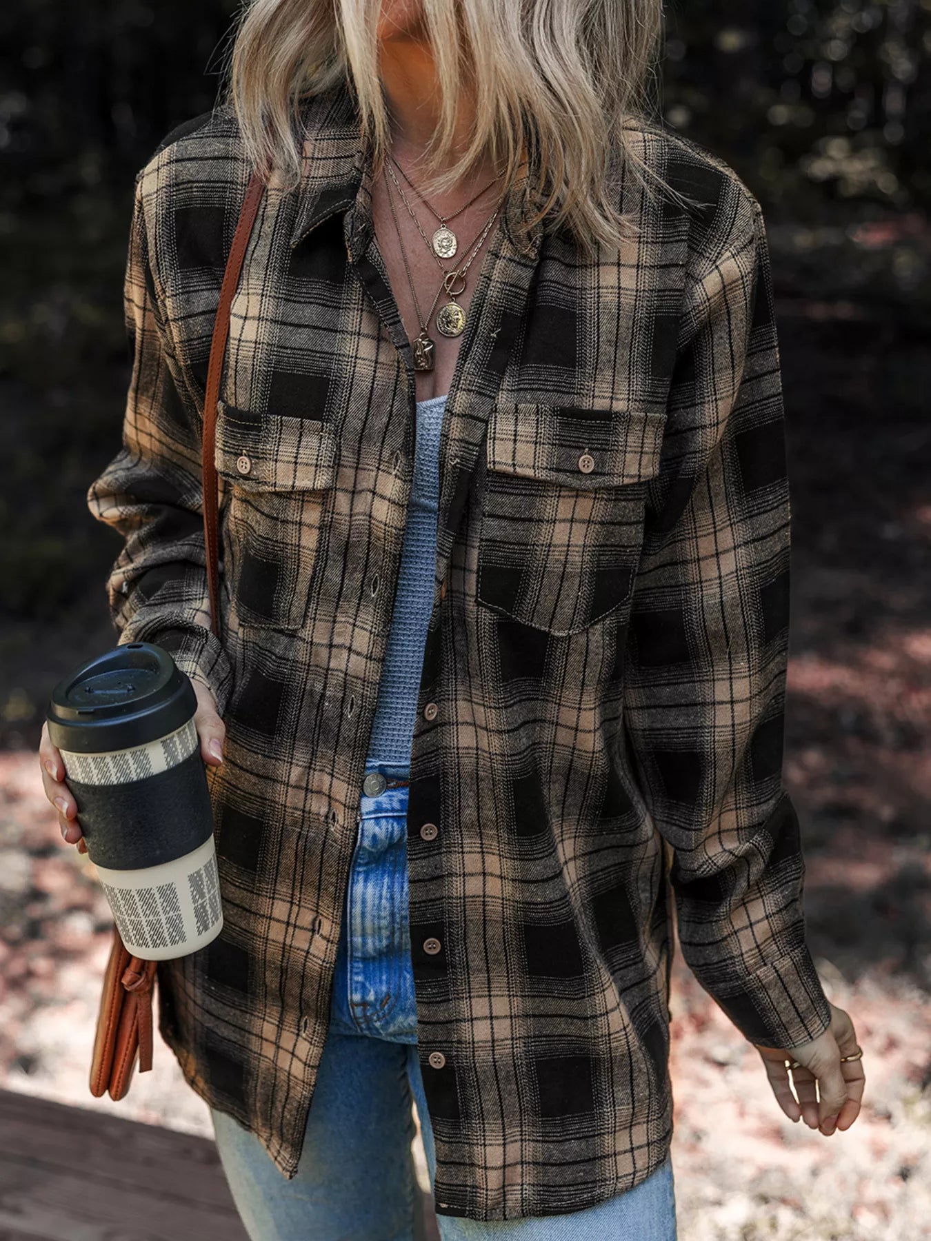 Neutral tan and black plaid button-down shirt for women.