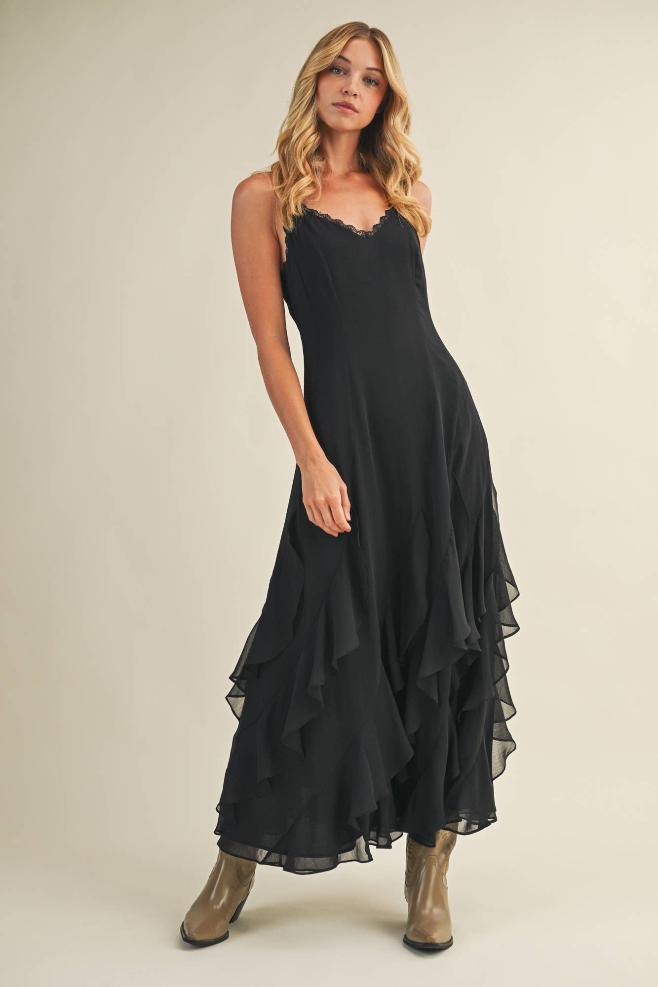 Romantic neutral ruffle maxi dress with lace trim neckline.