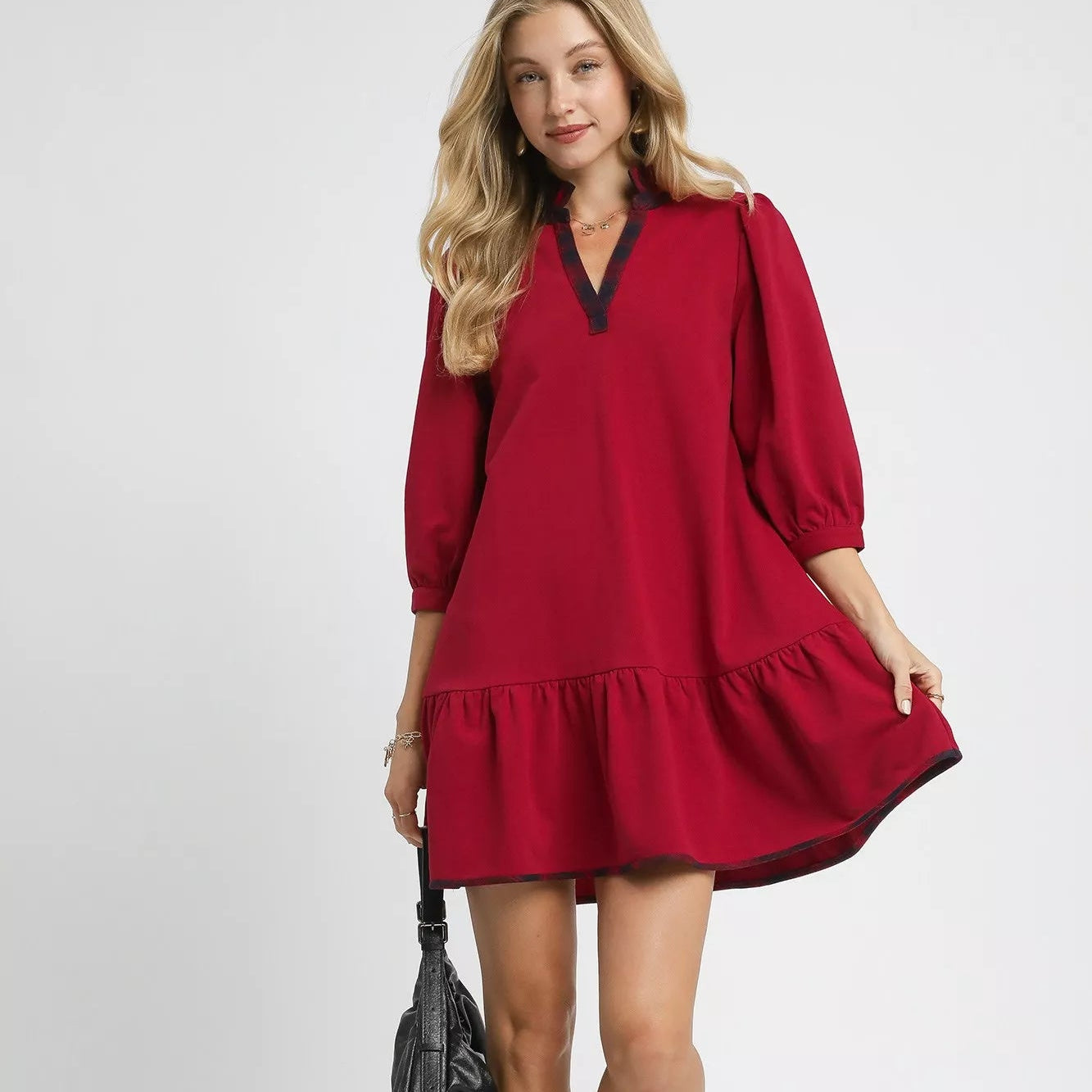 Holiday-ready red dress with plaid accents.