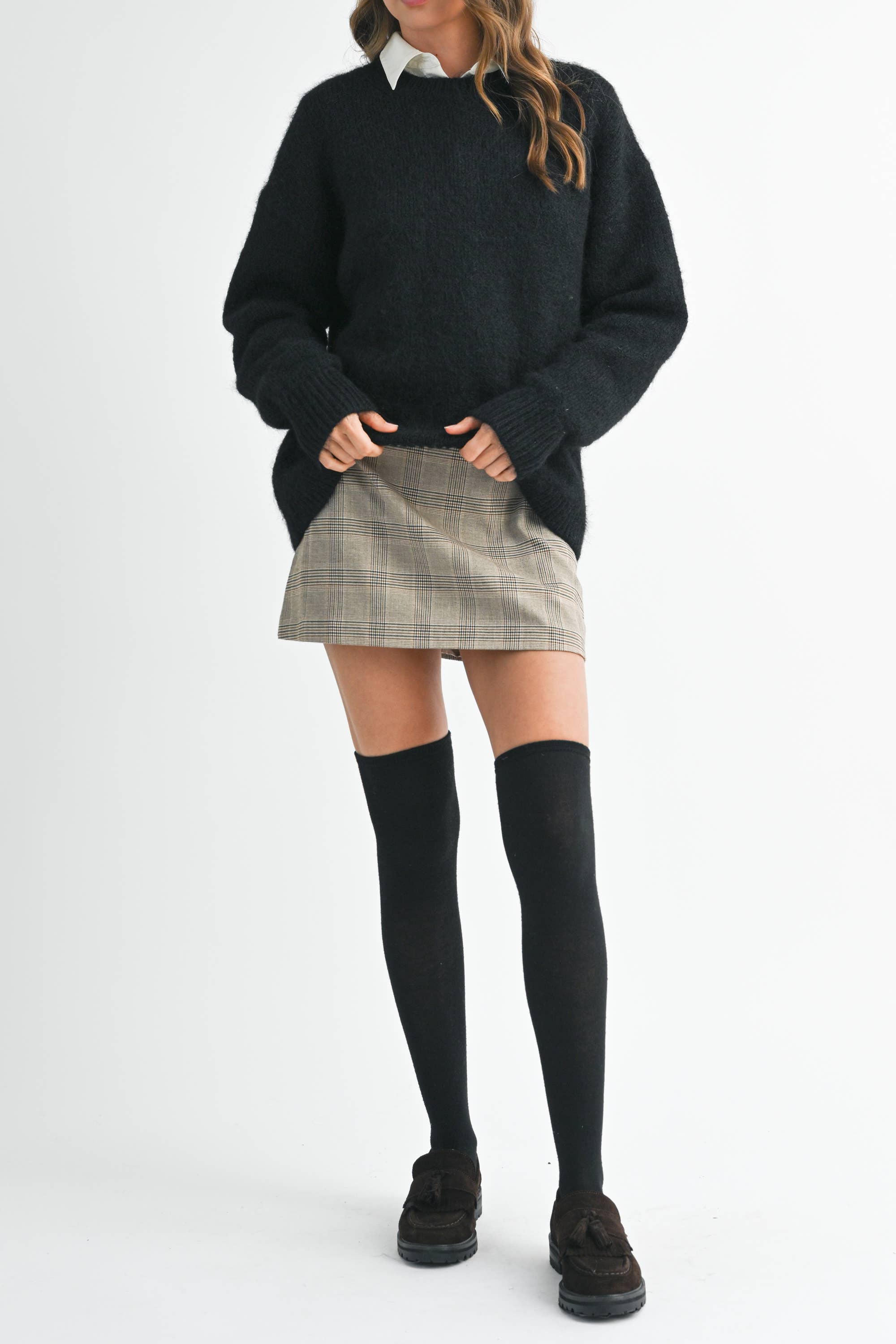 Black fuzzy sweater layered over collared shirt – Everest Rose Boutique.
