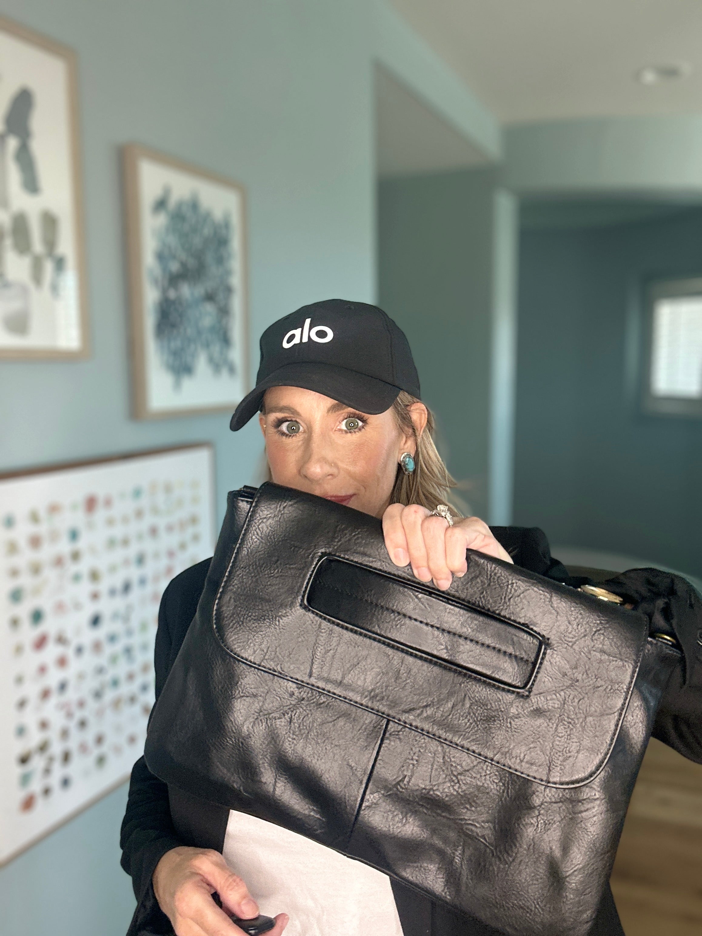 Large faux leather clutch bag with removable strap.