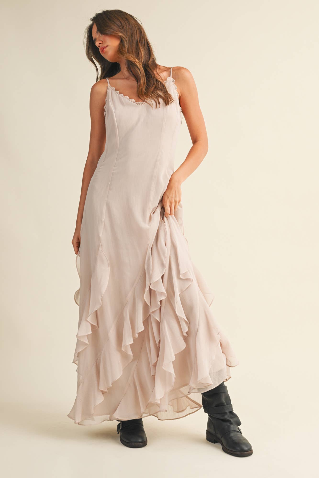 Feminine slip dress in soft beige with tiered ruffle skirt.
